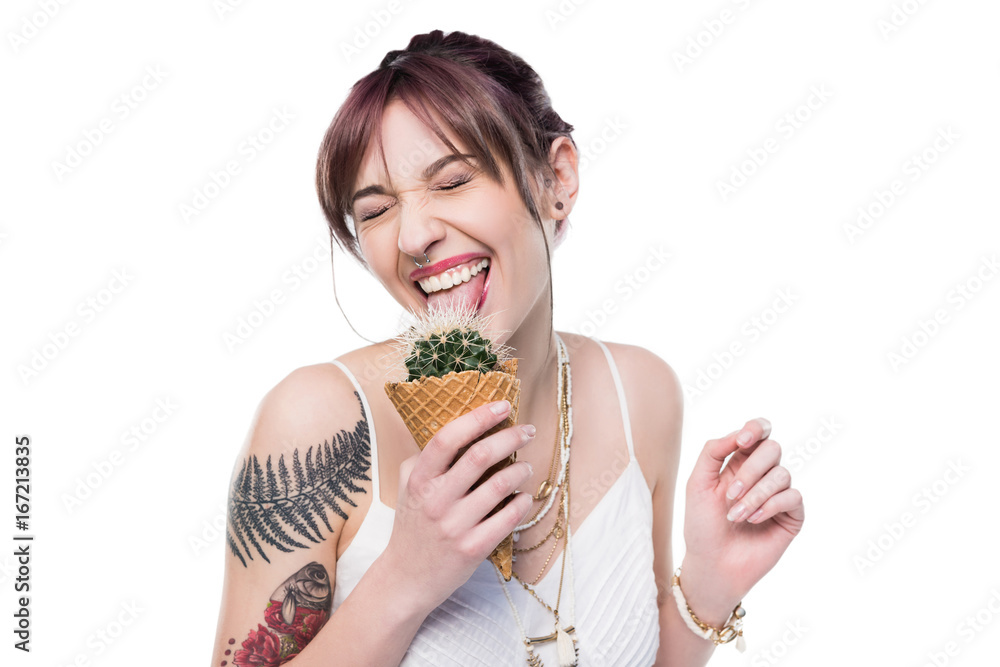 smiling young woman with closed eyes licking cactus in waffle cone isolated on white smiling young woman with closed eyes licking cactus in waffle cone isolated on white