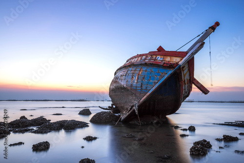 beautiful sunset ,boat crashes in the sea , landscape Thailand