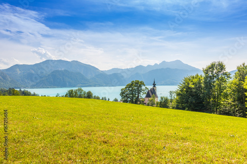 romantic church Sankt Andreas with beautiful view to the lake Attersee in Austria