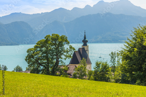 romantic church Sankt Andreas with beautiful view to the lake Attersee in Austria