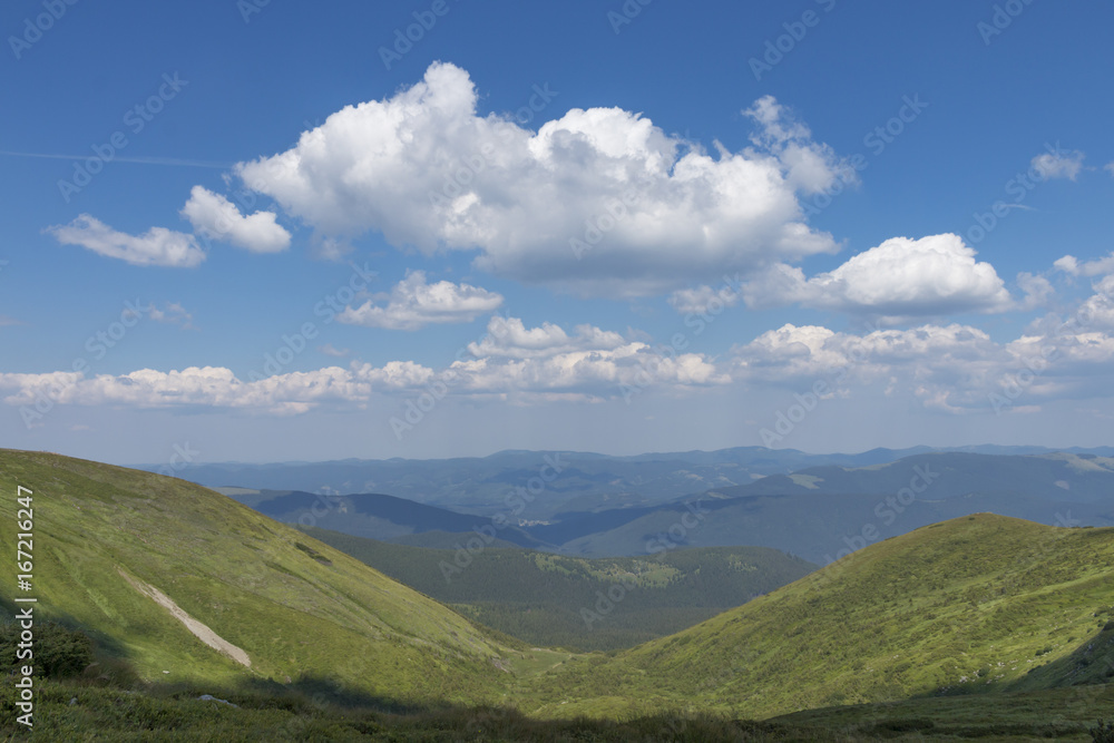 Panoramic view of the Carpathian mountains in a nice summer day, Bukovel, Ukraine Panoramic view of the Carpathian mountains in a nice summer day, Bukovel, Ukraine