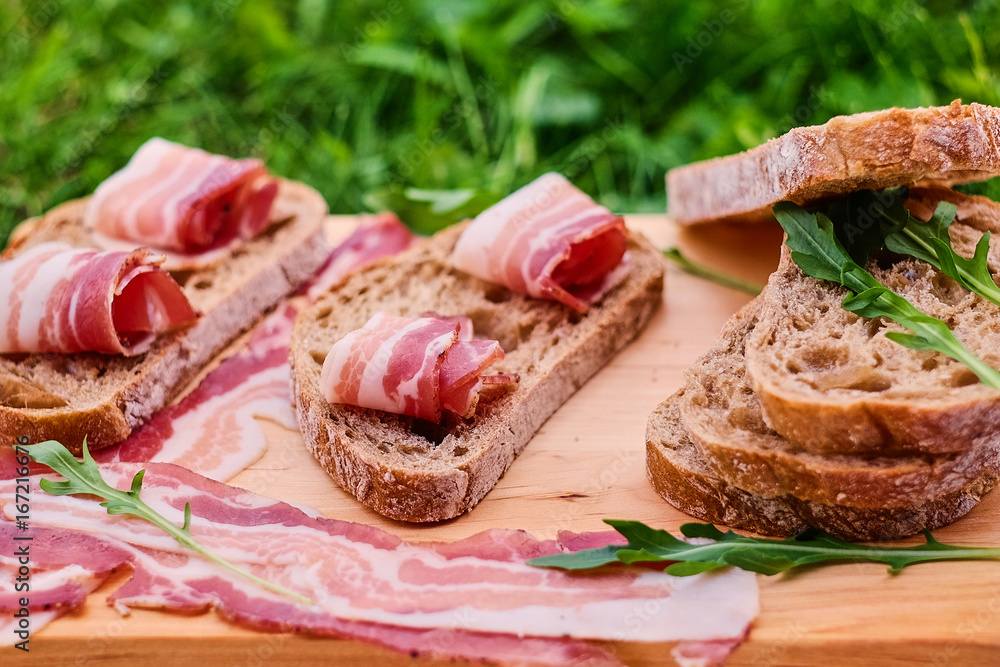 Bread with gourmet meat on a wooden desk. Bread with gourmet meat on a wooden desk.