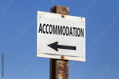 Accommodation word and arrow signpost