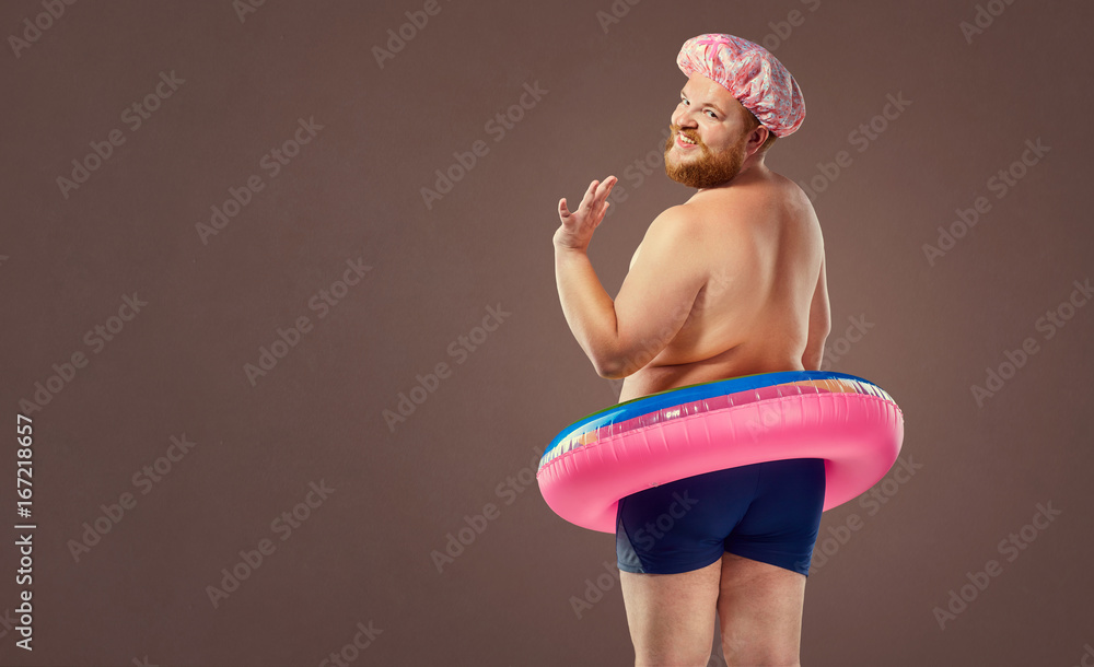 Funny bearded man prepared for beach vacation - obrazy, fototapety, plakaty 
