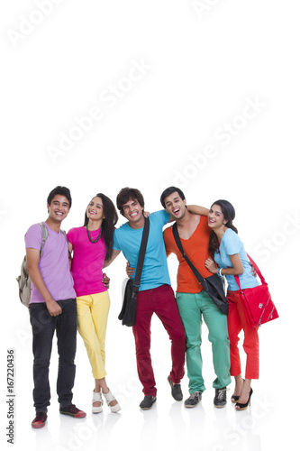 Full length of happy young friends standing isolated over white background