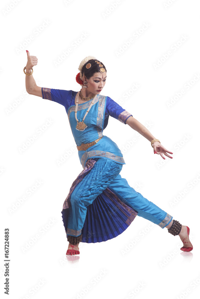 Full length of young woman performing Bharatanatyam