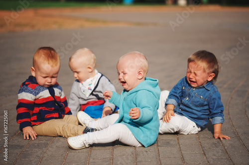 cute little children sitting in the circle