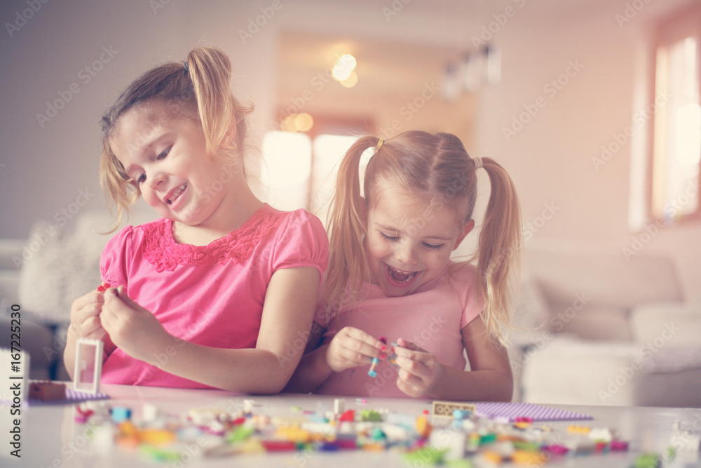 Fototapeta premium Girls playing at home.