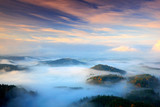  Czech typical autumn landscape. Hills and villages with foggy morning. Morning fall valley of Bohemian Switzerland park. Hills with fog, landscape of Czech Republic, landscape from Ceske Svycarsko.