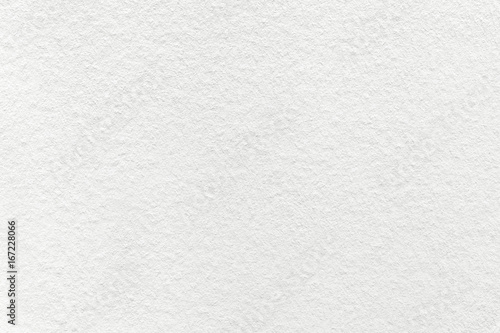 Texture of old light white paper background, closeup. Structure of dense cream cardboard