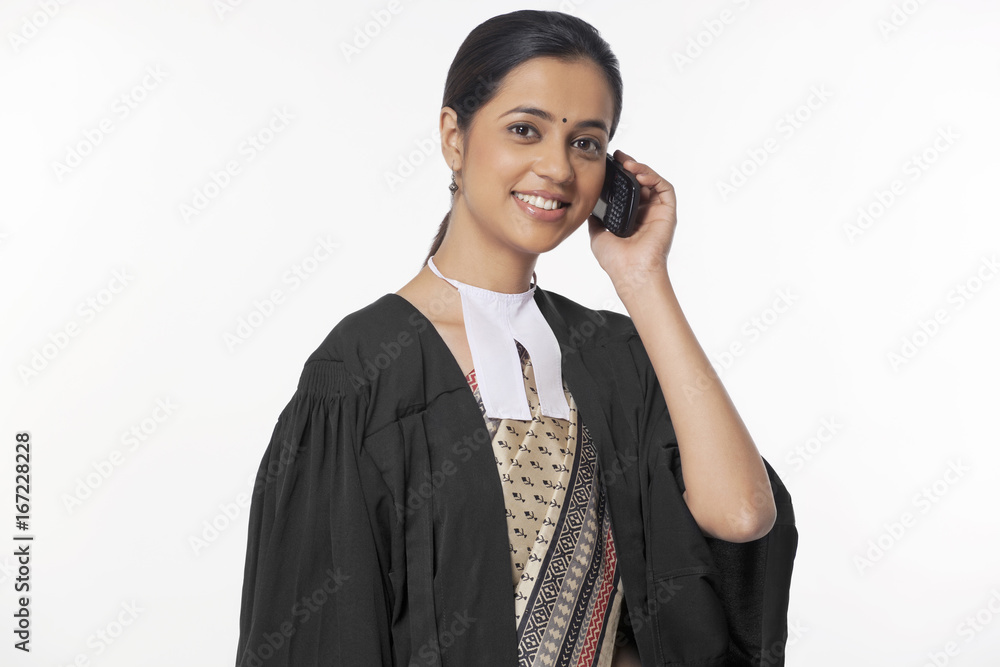 Portrait of happy young female lawyer on call isolated over white background 