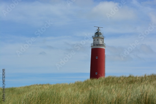 A red lighthouse on the island of Texel