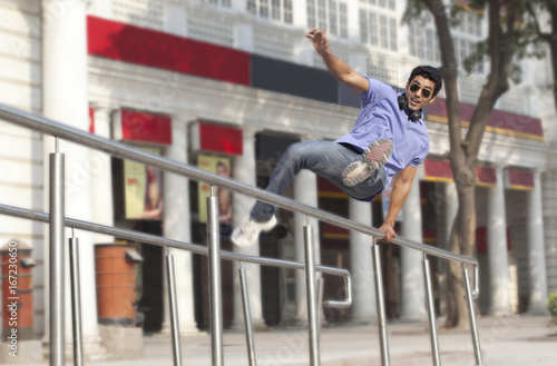 Man jumping over railings 