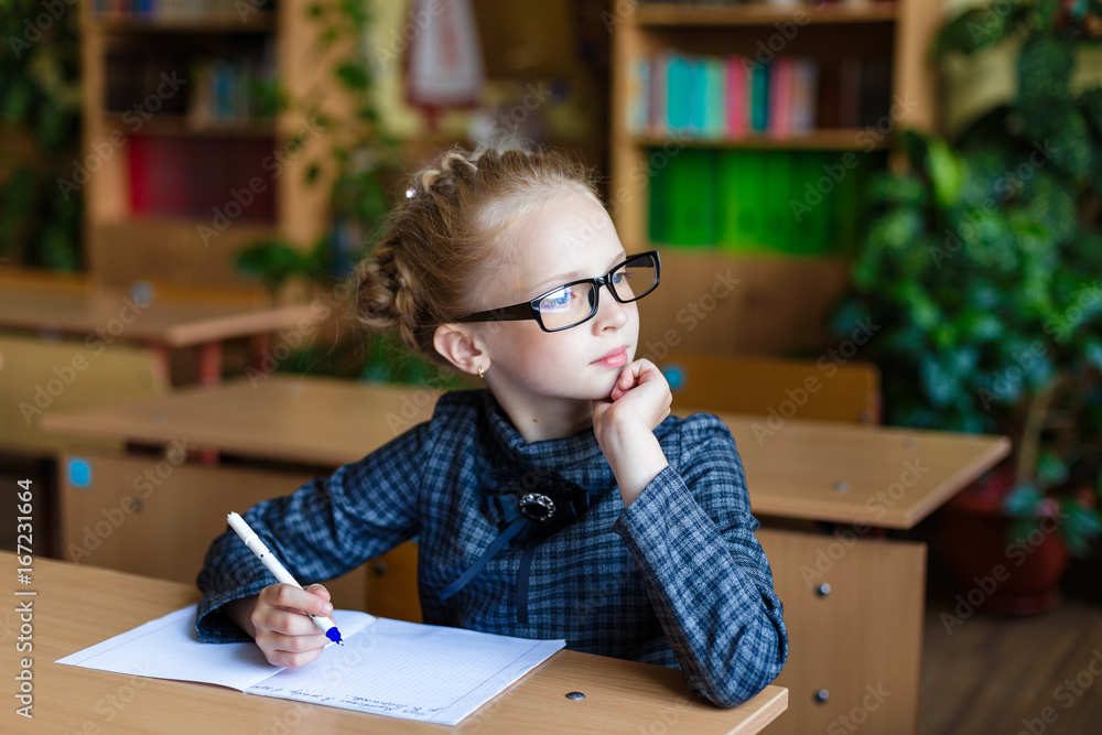 Girl at school desks