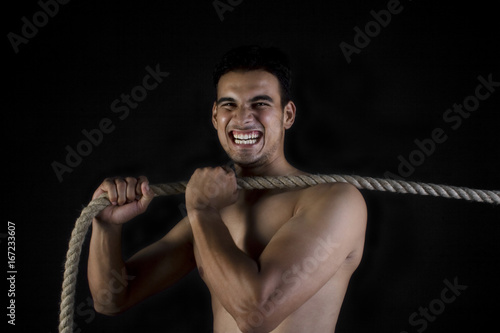 Man pulling a rope 