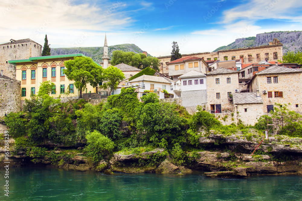 A beautiful view of the Neretva River in Mostar, Bosnia and Herzegovina, on a sunny summer day
