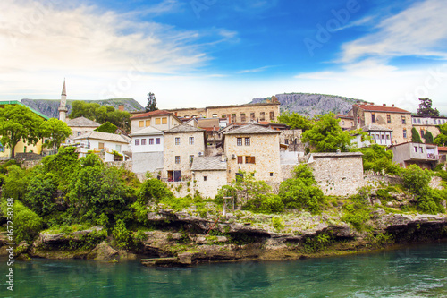 A beautiful view of the Neretva River in Mostar, Bosnia and Herzegovina, on a sunny summer day
