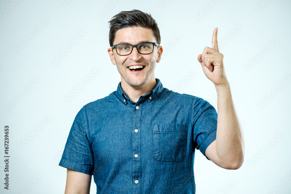 Handsome smiling bearded man pointing away Handsome smiling bearded man pointing away