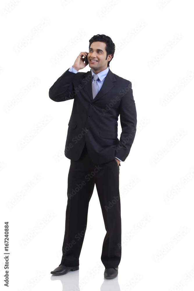 Businessman talking on a mobile phone Businessman talking on a mobile phone