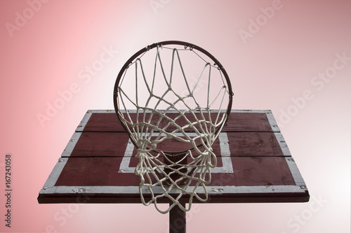 Basketball hoop with vintage wooden board on gradient background