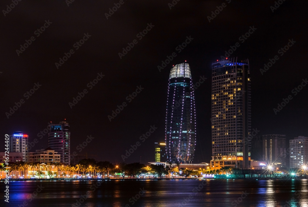 Night view of modern buildings and Han River in Danang city