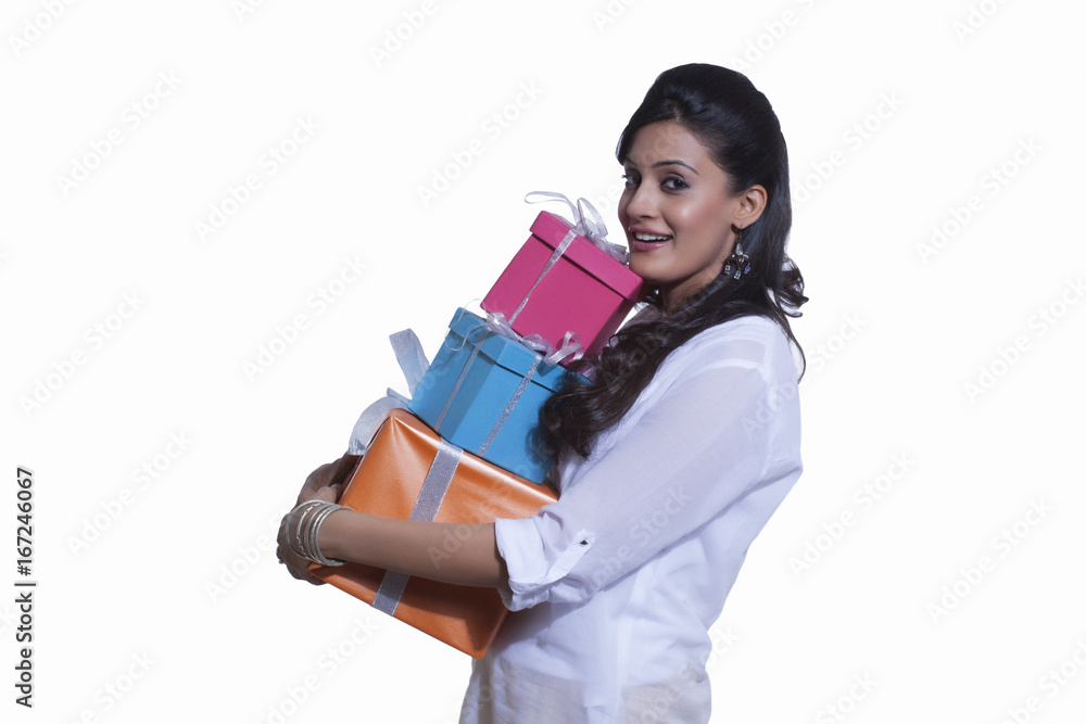 Portrait of a woman holding gift boxes Portrait of a woman holding gift boxes