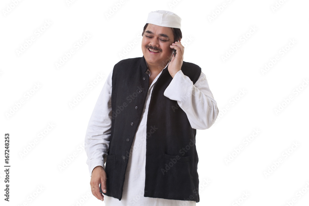 Smiling politician talking on cell phone 