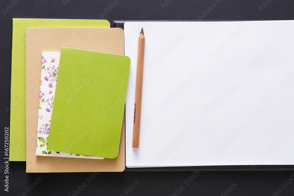 Mockup with set of various colorful notebooks Mockup with set of various colorful notebooks