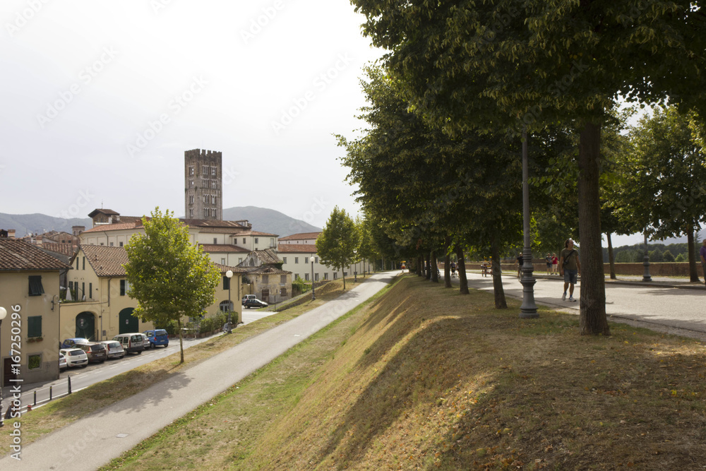 LUCCA, ITALY - AUGUSt 15 2015: Pedestrian path surrounding Lucca fortified walls boudaries