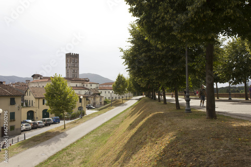 LUCCA, ITALY - AUGUSt 15 2015: Pedestrian path surrounding Lucca fortified walls boudaries