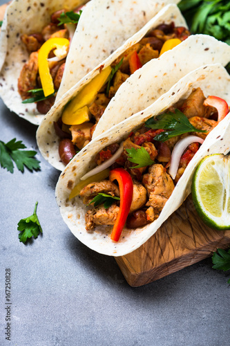 Mexican taco with meat beans and vegetables. Traditional latin american street food menu. 
