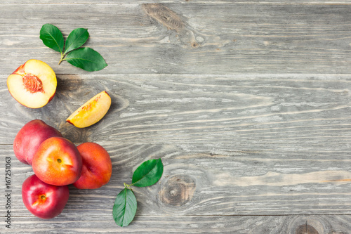Fresh organic fruit on wooden background. Top view copy space.