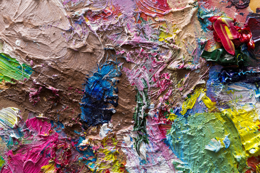 Palette with colorful mixed oil-paints texture