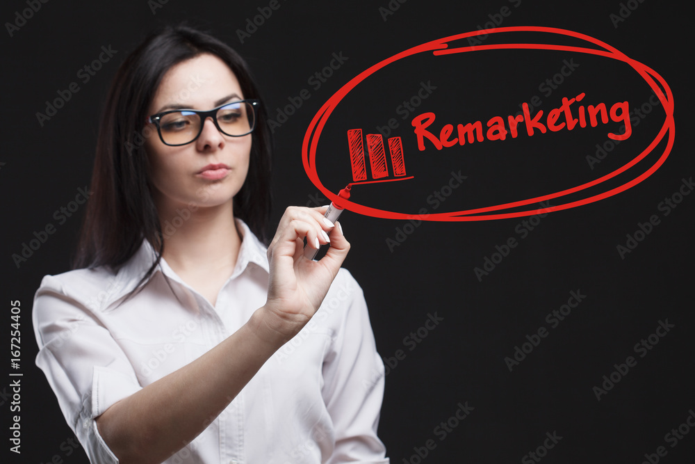 The concept of business, technology, the Internet and the network. A young entrepreneur working on a virtual screen of the future and sees the inscription: Remarketing The concept of business, technology, the Internet and the network. A young entrepreneur working on a virtual screen of the future and sees the inscription: Remarketing