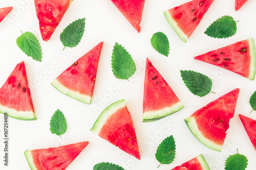Pattern of watermelon and leaves. Sliced watermelon on white background. Flat lay, top view
