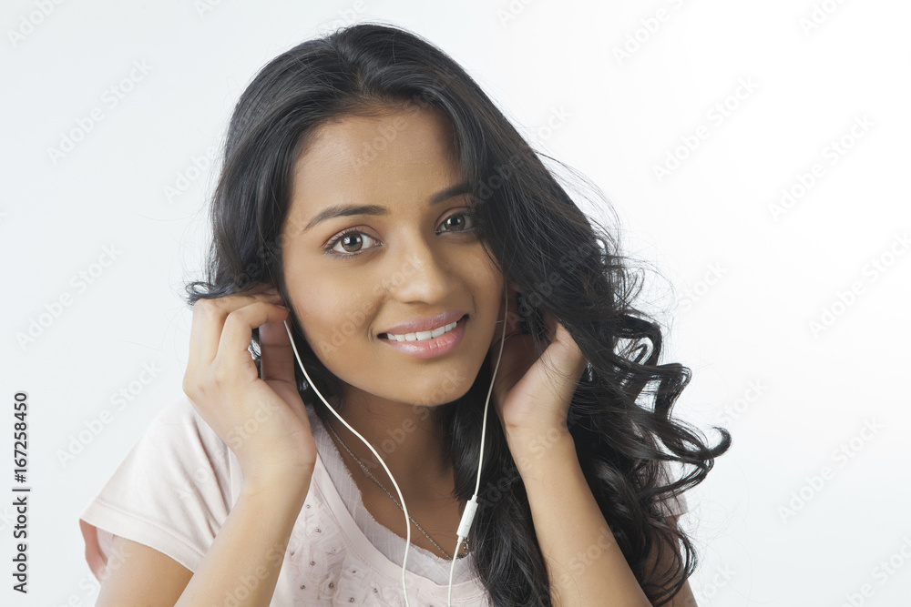Portrait of a woman with ear phones Portrait of a woman with ear phones