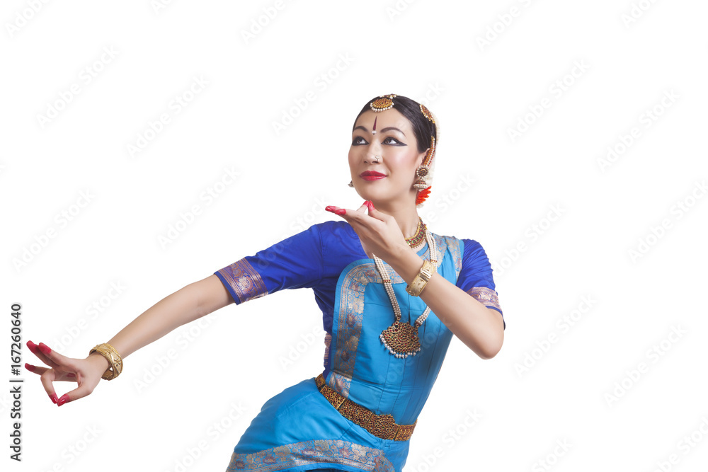 Young woman performing Indian Bharat Natyam dance over white background Young woman performing Indian Bharat Natyam dance over white background