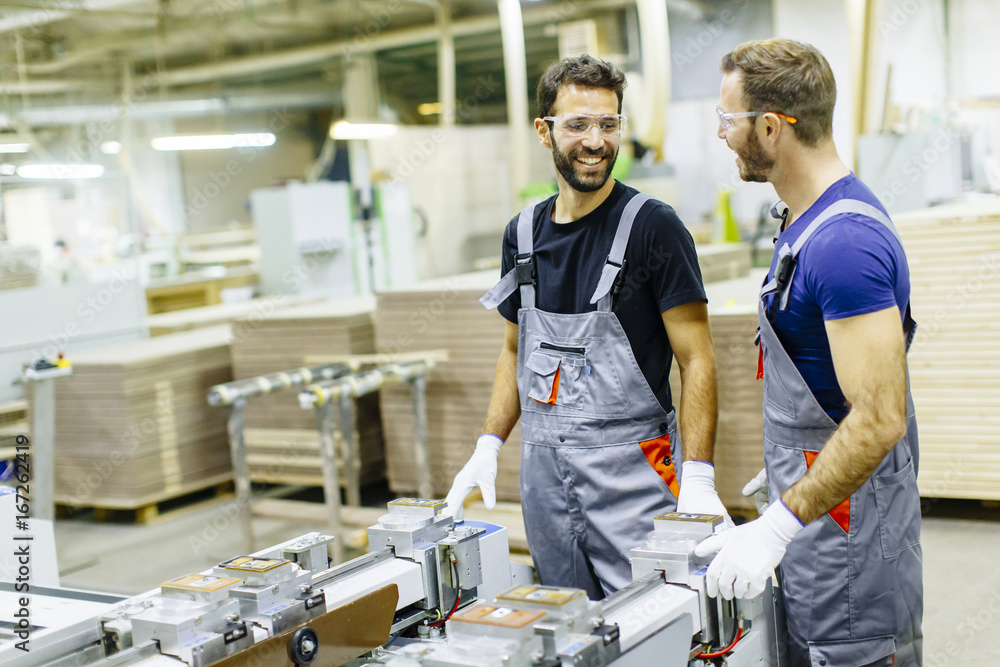 Young workers working in furniture factory Young workers working in furniture factory