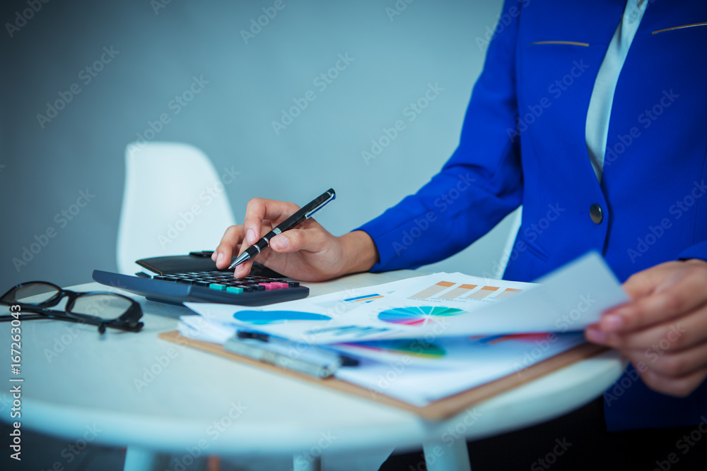 Female financial officer analyzing investment data report Female financial officer analyzing investment data report