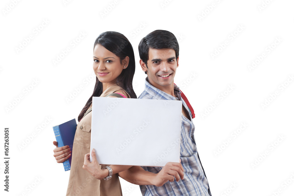Portrait of college students holding a white board Portrait of college students holding a white board