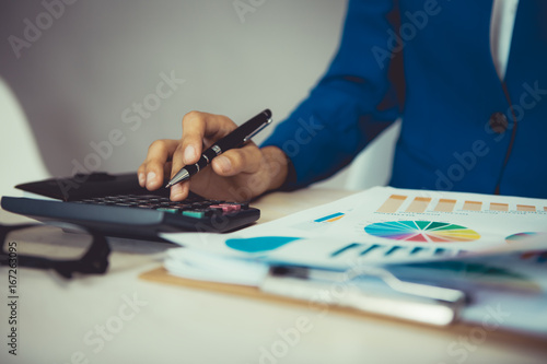 Female financial officer analyzing investment data report