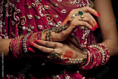 Close-up of jewelery on hands of Indian bride 