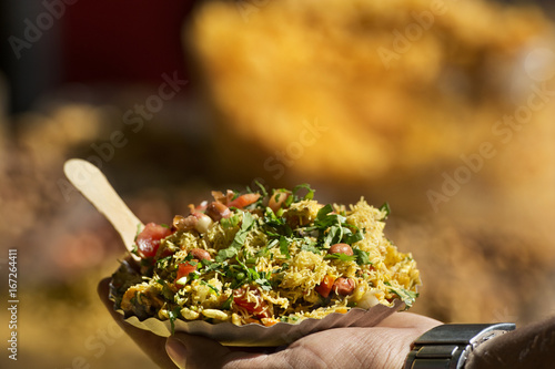 Photography Man holding Bhelpuri plate