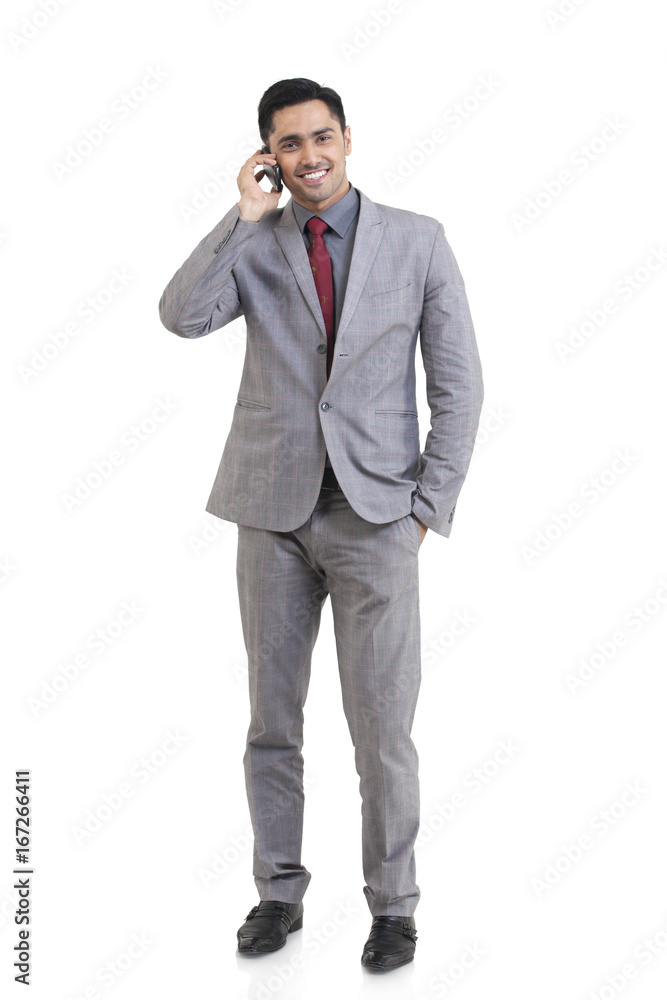 Portrait of businessman talking on a mobile phone Portrait of businessman talking on a mobile phone