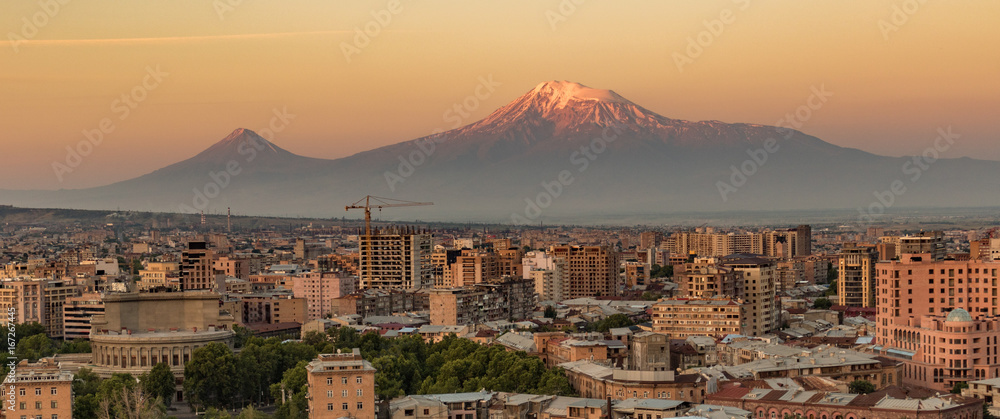 City skyline of Yerevan at sunrise, with Mt Ararat in background