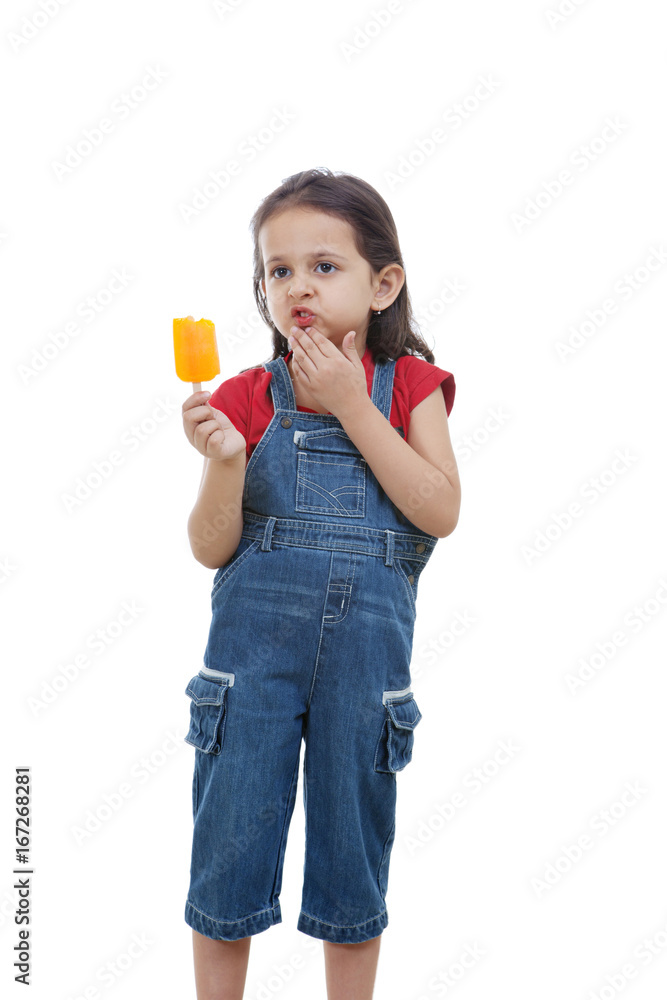 Cute girl holding flavored ice over white background Cute girl holding flavored ice over white background