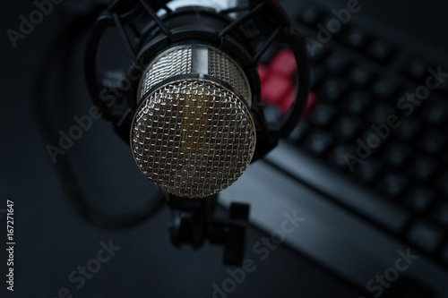 Professional condenser studio microphone over the keyboard
