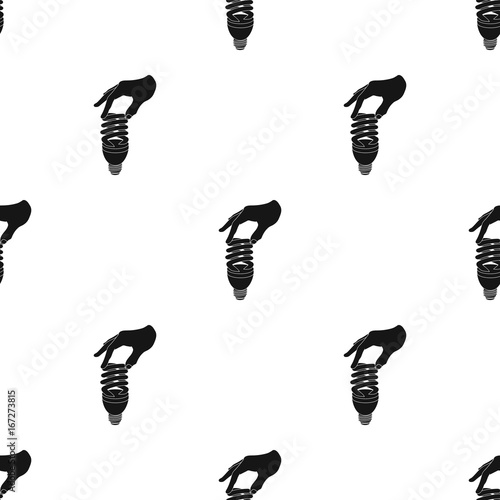 Fluorescent, saving light bulb in hand. Electric lamp single icon in black style vector symbol stock illustration web.