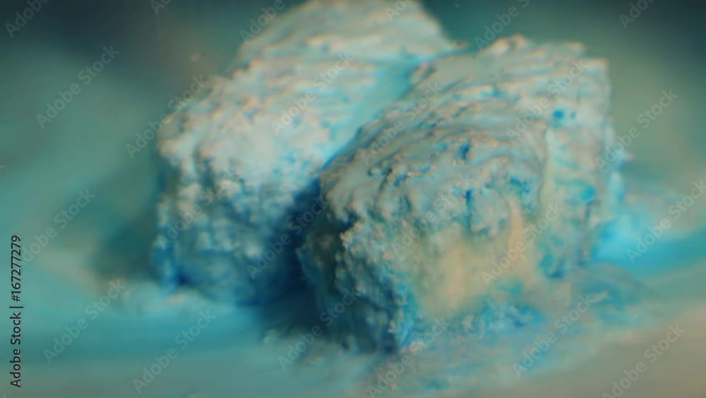 Timelapse, blue pills dissolve in water Timelapse, blue pills dissolve in water
