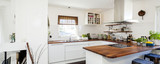 horizontal banner of fancy kitchen with wooden counter top